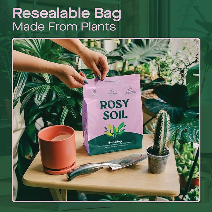 Hands opening a resealable bag of seedling soil on a table with a potted plant and gardening tools in a green indoor setting.