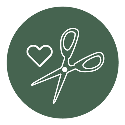 White icon of scissors and a heart on a dark green circular background.