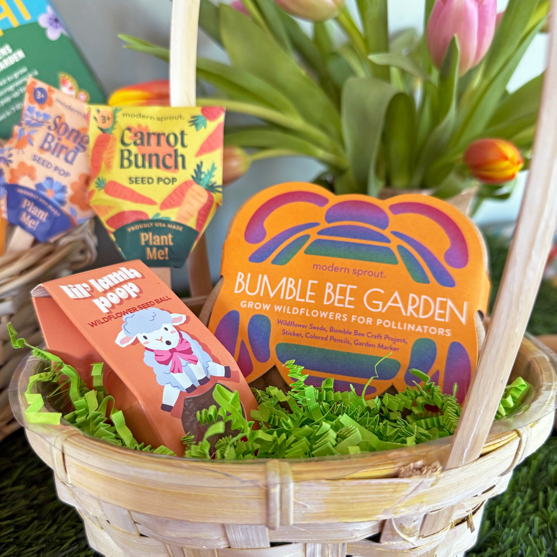 Limited edition Easter basket featuring seed packets for wildflowers, colorful packaging, and decorative grass.