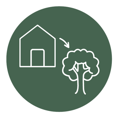 Icon of a barn and a tree in white on a dark green circular background.