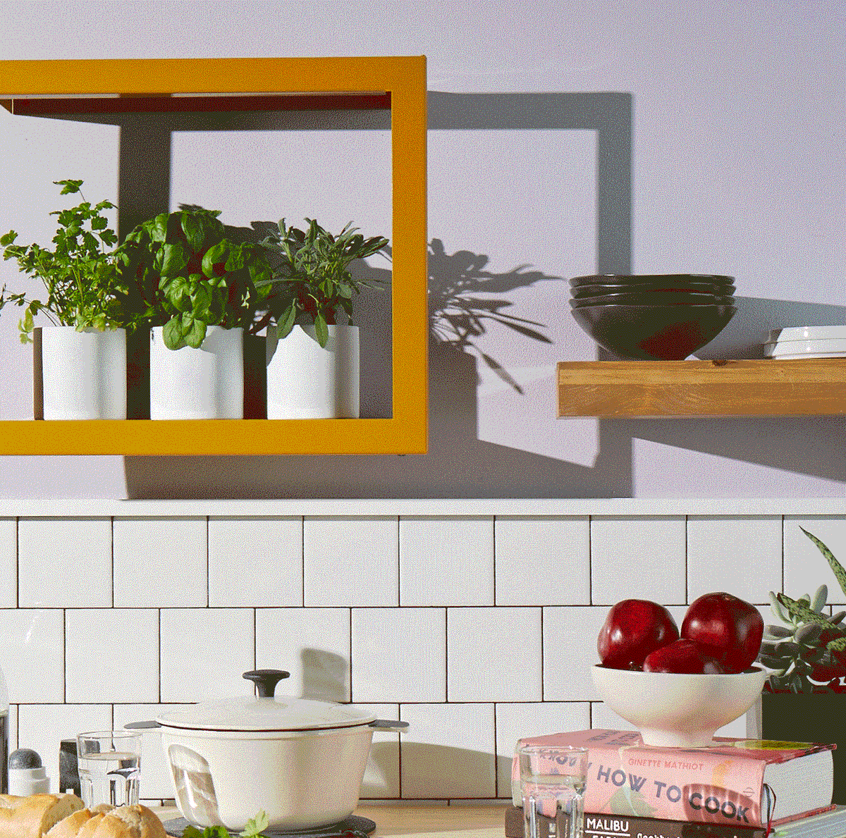 White hydroponic indoor garden with basil on kitchen counter, modern decor.