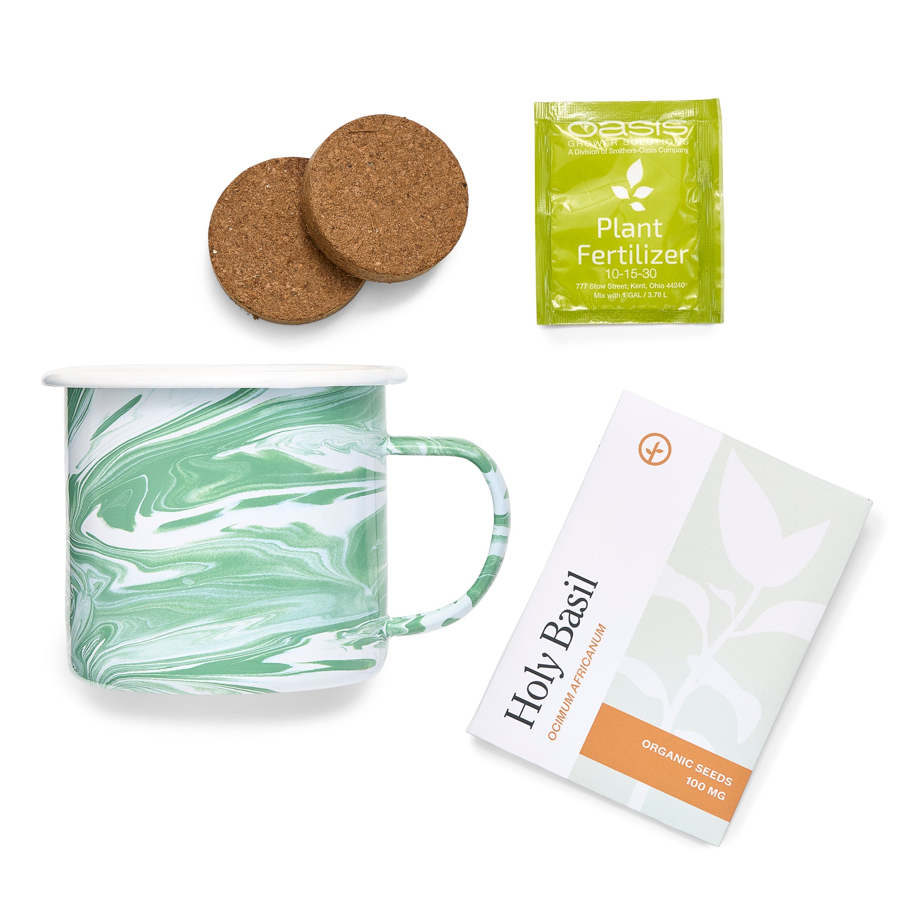 Marbled green mug with cork coasters, plant fertilizer packet, and organic holy basil seed packet for growing herbs.