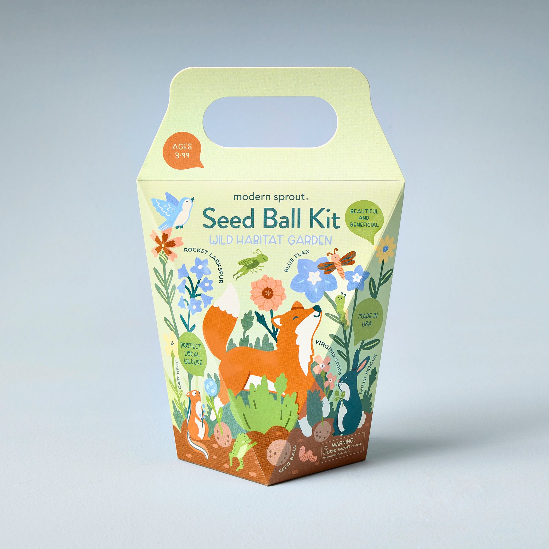 Colorful seed ball kit packaging featuring a fox and various plants, designed for creating a wild habitat garden.
