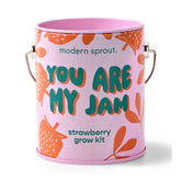 Pink grow kit featuring playful text "You Are My Jam" and strawberry illustrations, designed for growing strawberries.