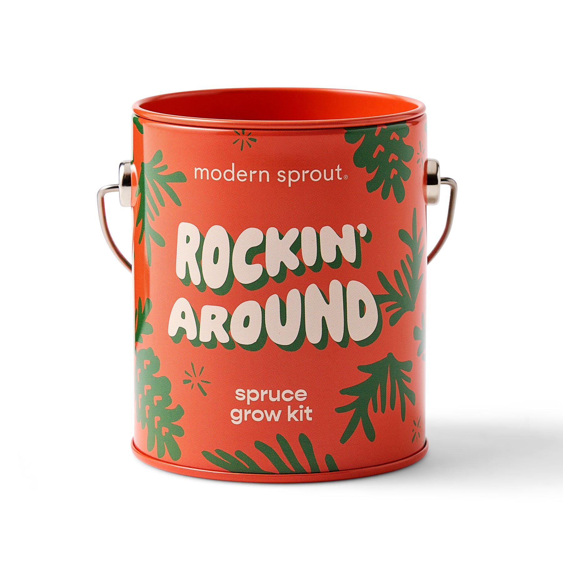 Bright red tin container labeled "Rockin' Around" with green foliage design, containing a spruce grow kit for indoor gardening.