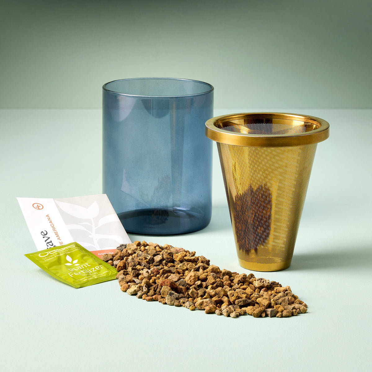 Agave Grow Kit featuring a blue container, a gold mesh pot, planting medium, and seed packets for easy cultivation.