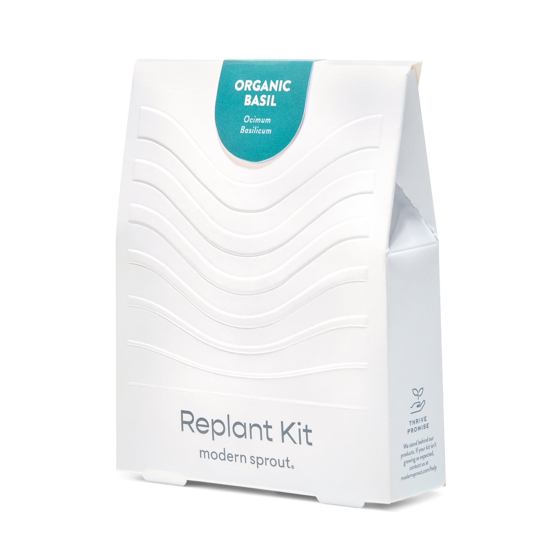 White packaging of the Immersion Hydroponic Replant Kit featuring organic basil, designed for easy indoor gardening.