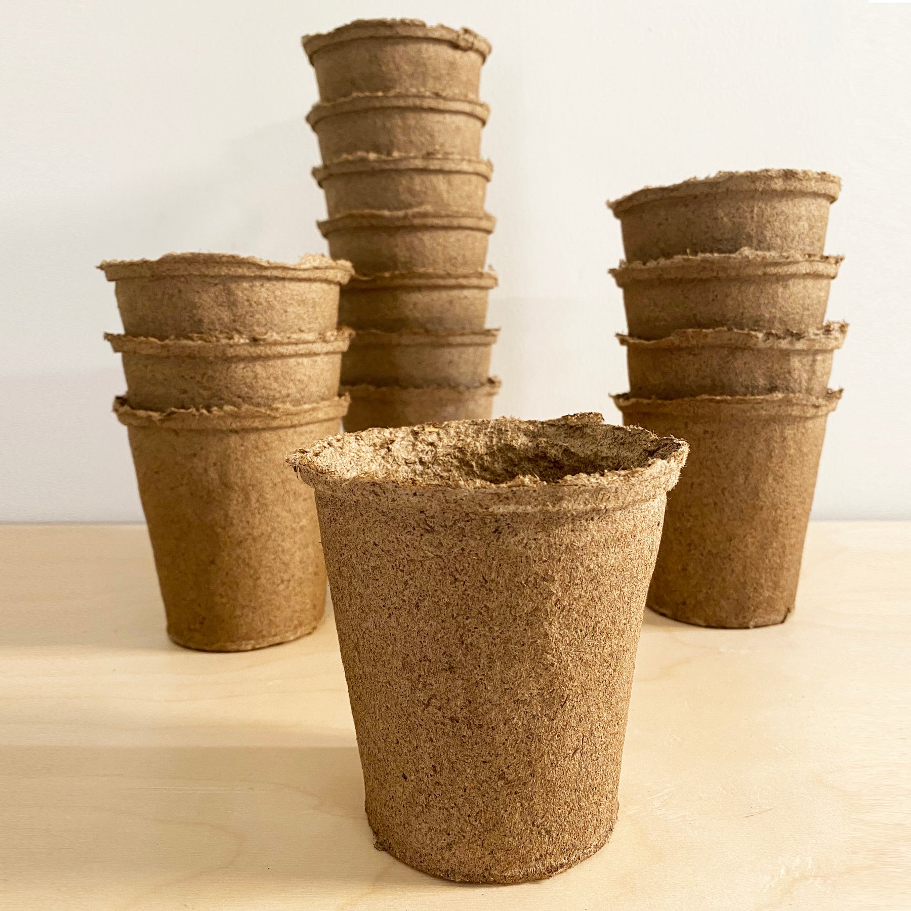 Eco-friendly 4-inch CowPots in a 15-pack, made from biodegradable materials for sustainable planting.