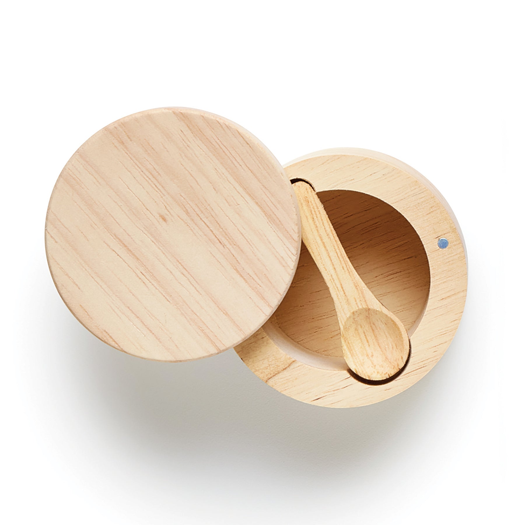 Natural wood salt cellar with a matching spoon, featuring a rounded design and a lid partially open.