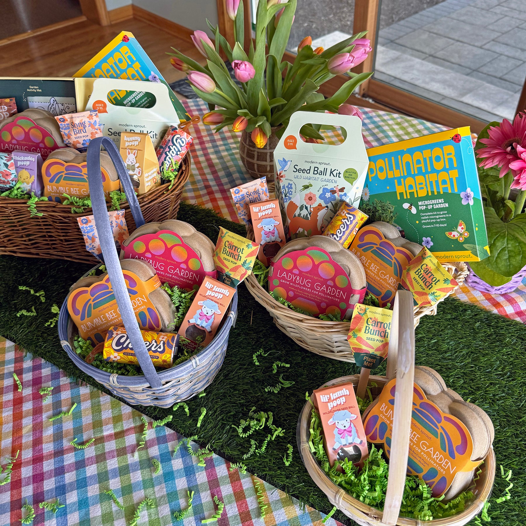Colorful limited edition Easter baskets filled with gardening kits, seed balls, and festive treats, arranged on a table.