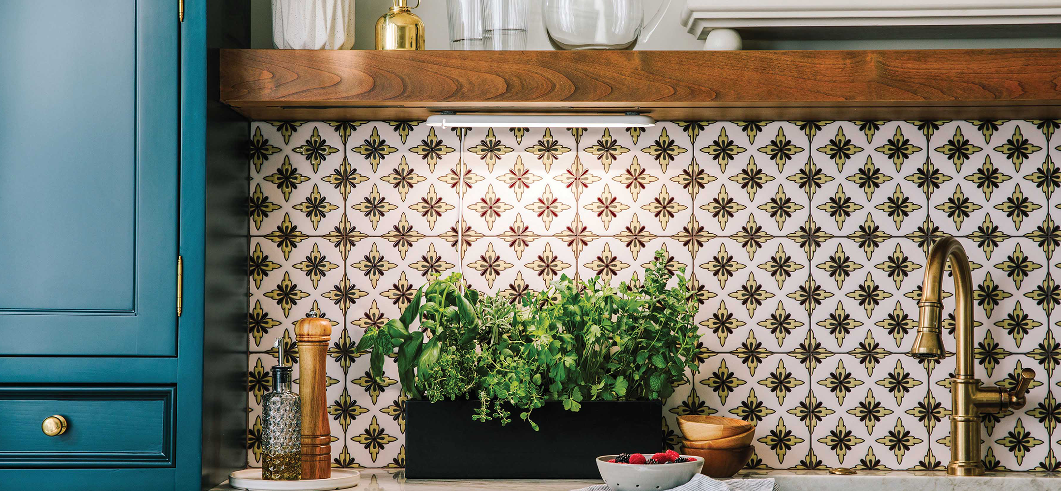 Compact indoor hydroponic garden system with lush green herbs on a kitchen counter.