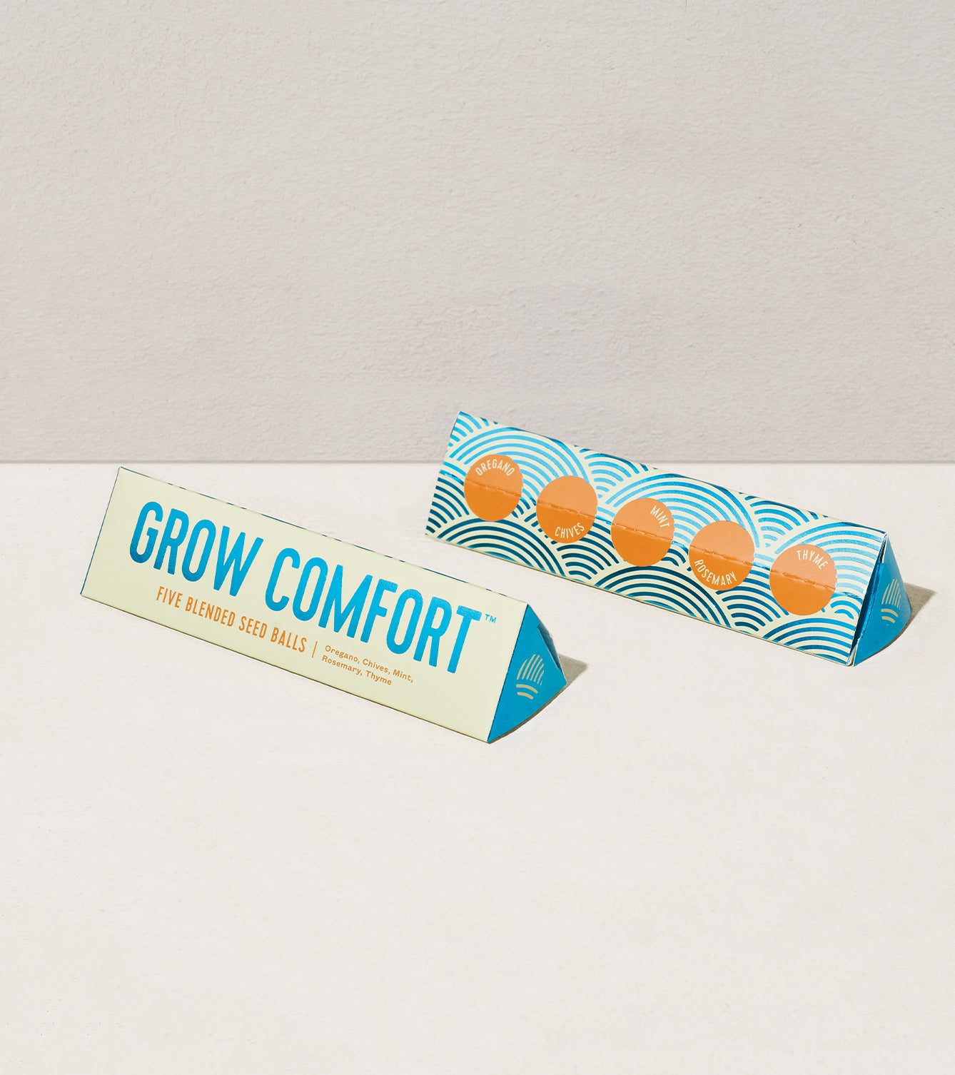 Bright Side Seed Balls packaging featuring "Grow Comfort" label and colorful design, showcasing five blended seed balls.