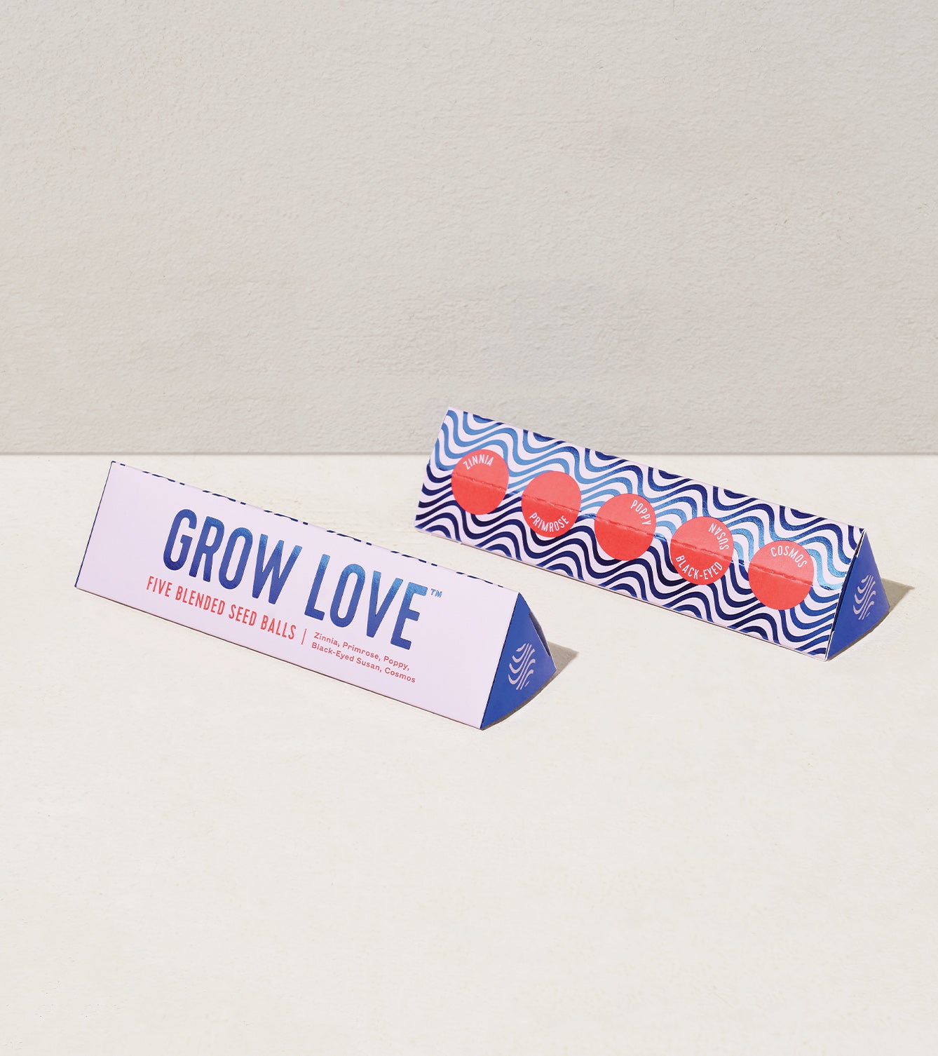 Bright Side Seed Balls packaging featuring "Grow Love" and colorful seed ball designs, ideal for planting flowers and herbs.