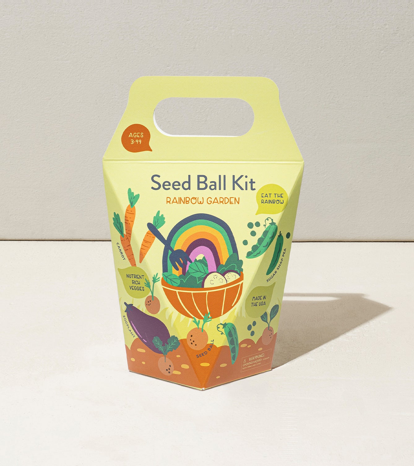 Colorful Seed Ball Kit for kids featuring a rainbow garden theme, promoting vegetable growth and outdoor fun.