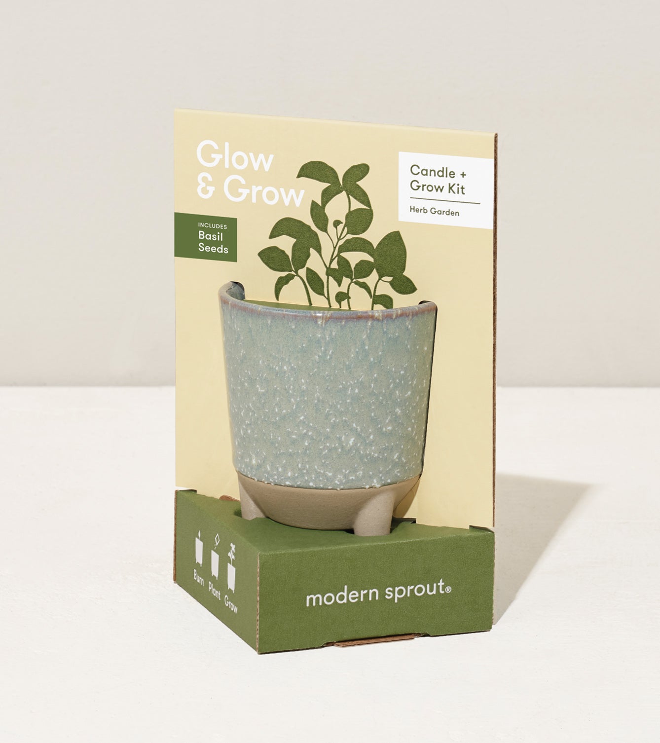 Glow & Grow Kit featuring a candle and basil seeds in a decorative pot, designed for indoor herb gardening.