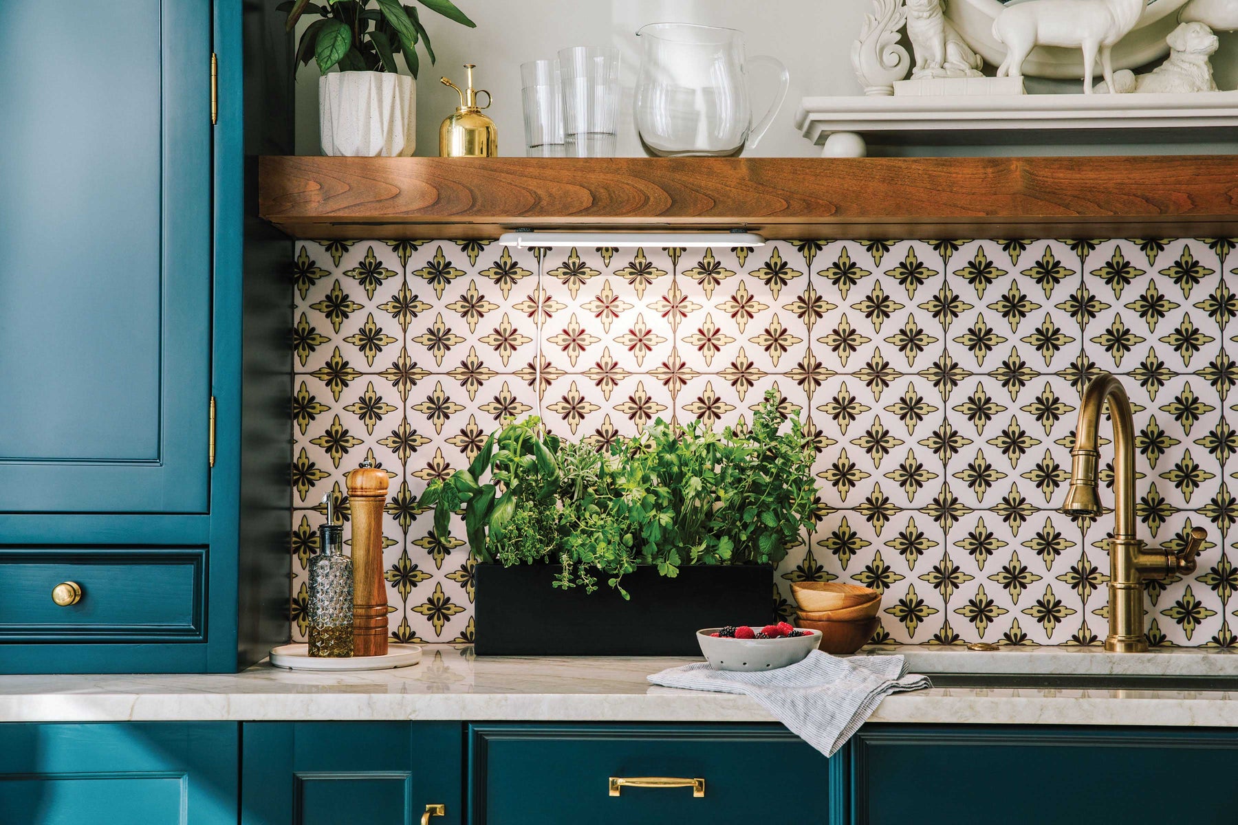 Smart Growbar illuminating a herb garden on a kitchen countertop, surrounded by decorative tiles and kitchenware.