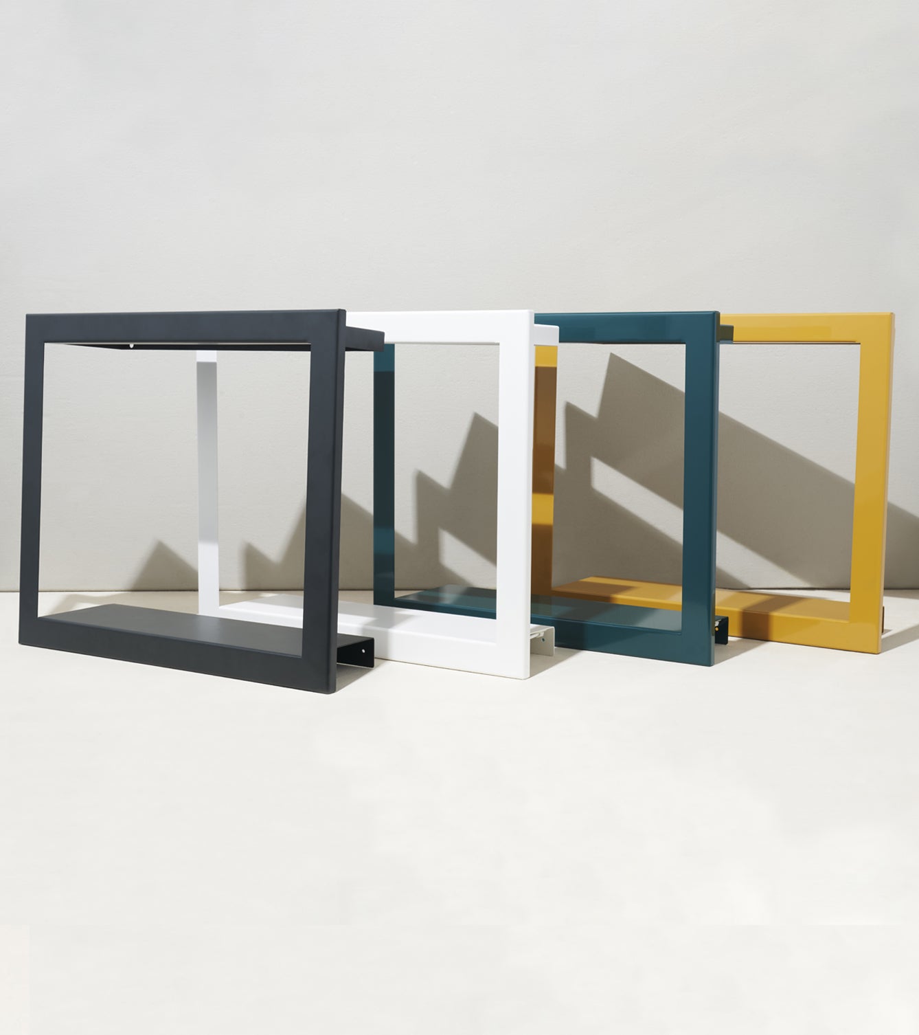 Four Smart Standard Growframes in black, white, teal, and mustard yellow arranged against a neutral background.