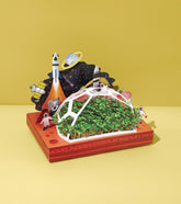 Microgreens Pop-Up Kit featuring a vibrant space-themed design with a dome and miniature rockets, showcasing lush green microgreens.