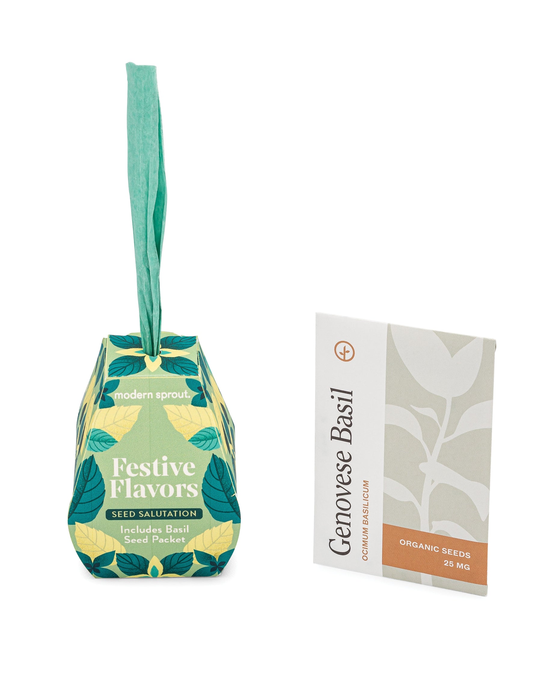Seed Salutations packaging featuring a colorful design with basil seed packet labeled "Genovese Basil" and a green paper tag.