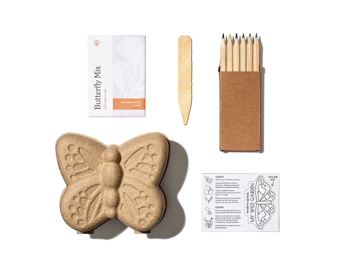 Curious Critters Garden Kit featuring a butterfly-shaped seed starter, planting instructions, colored pencils, and a craft stick.
