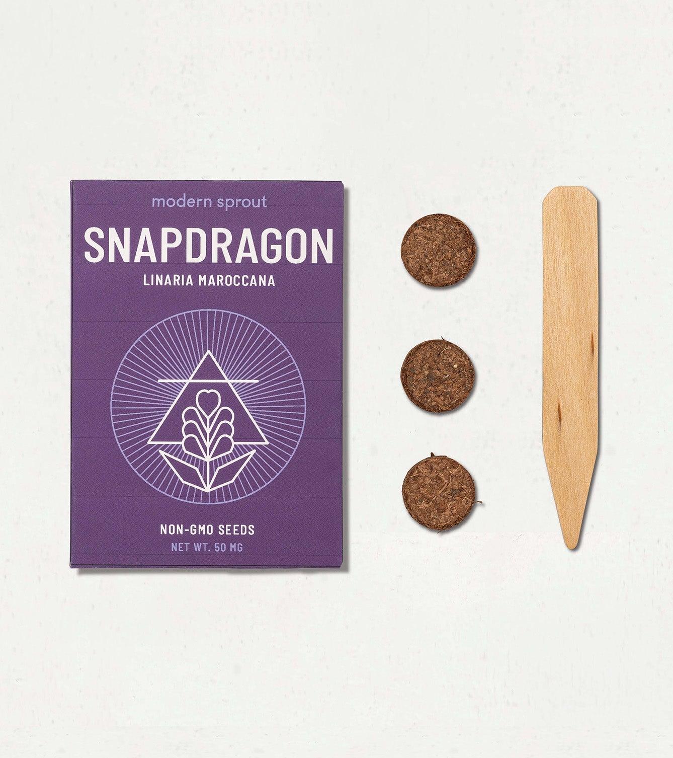 Snapdragon seed kit featuring a purple box, three seed discs, and a wooden plant marker for easy gardening.