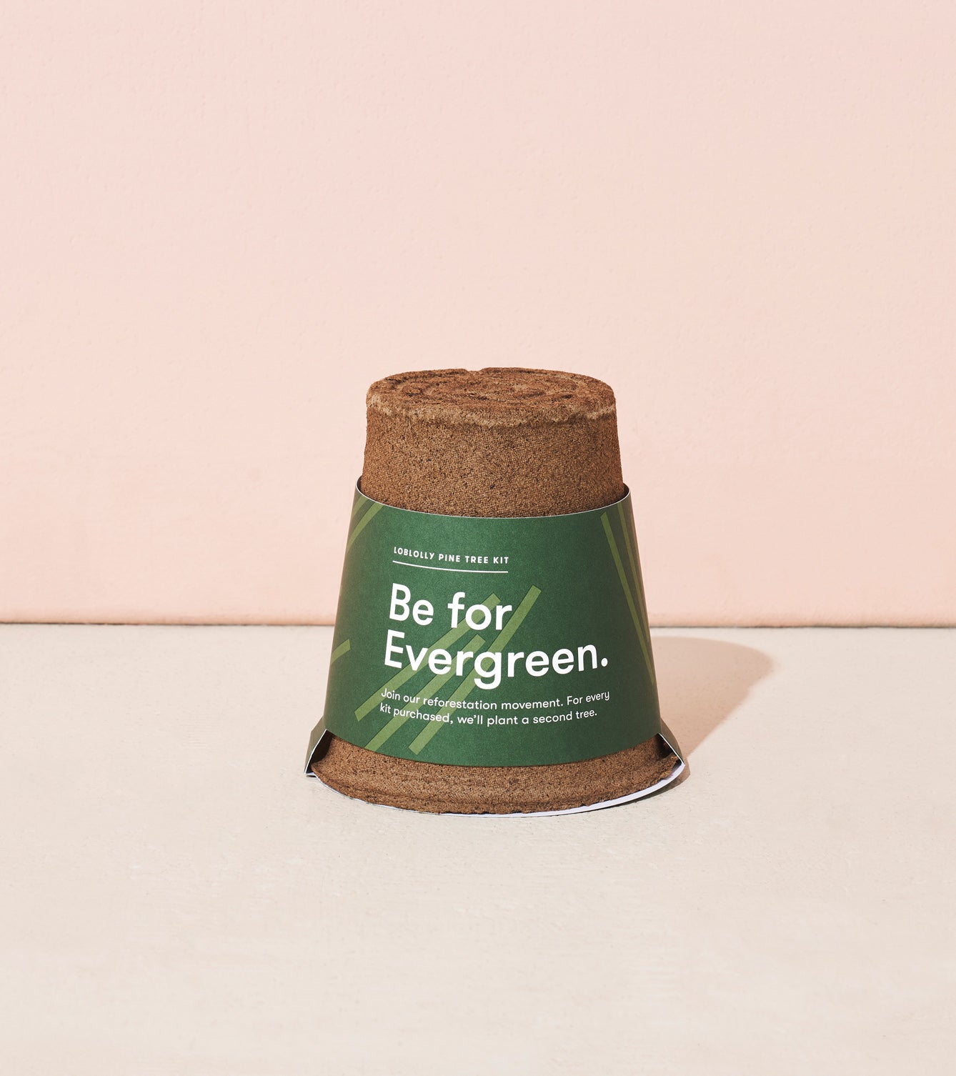 One-For-One Tree Kit featuring a biodegradable pot with a green label that reads "Be for Evergreen.