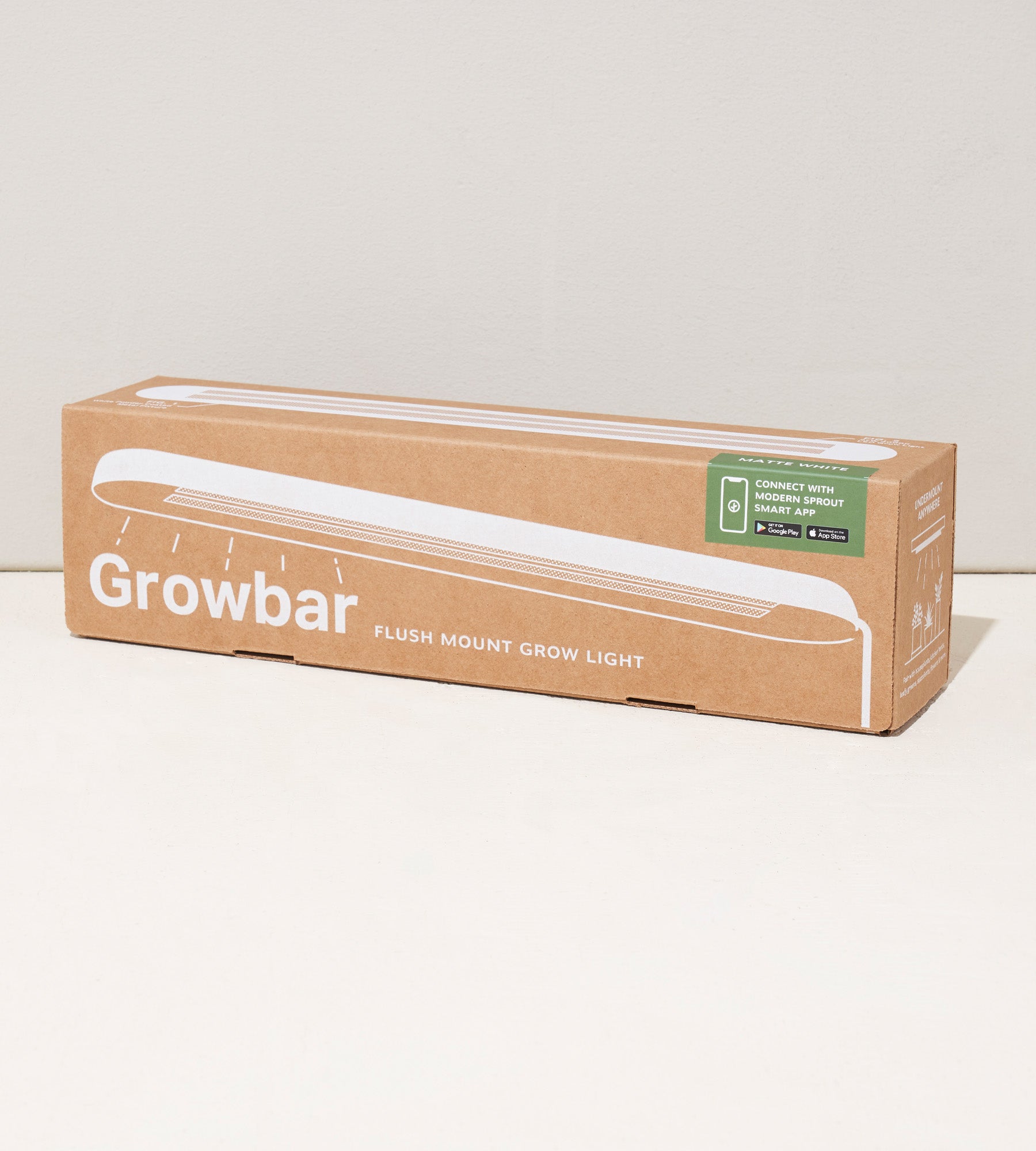 Cardboard packaging of the Smart Growbar, a flush mount grow light, featuring product details and app connectivity information.
