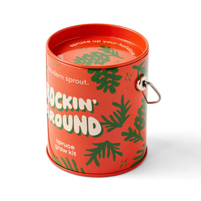 Brightly colored holiday grow kit in a decorative tin, featuring festive plant graphics and the text "Rockin' Around.