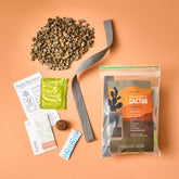 Passive Hydroponic Replant Kit featuring cactus seeds, growing medium, fertilizer, and planting instructions on a peach background.