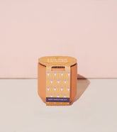Tiny Terracotta Kit featuring a lavender seed sprouting kit in an orange pot with a patterned label against a pink background.